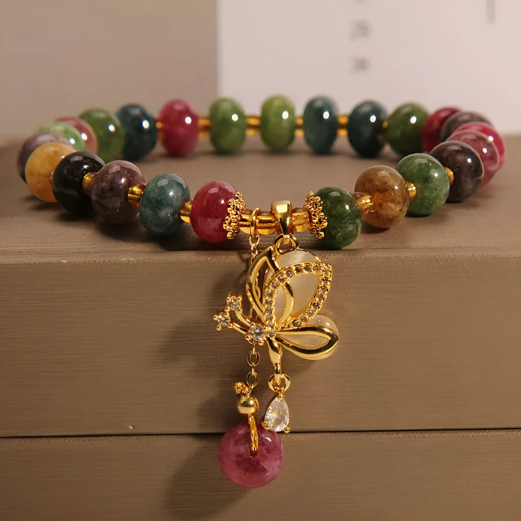 Colourful alloy bracelet for women with a butterfly charm and tourmaline beads on a fresh sweet style band.