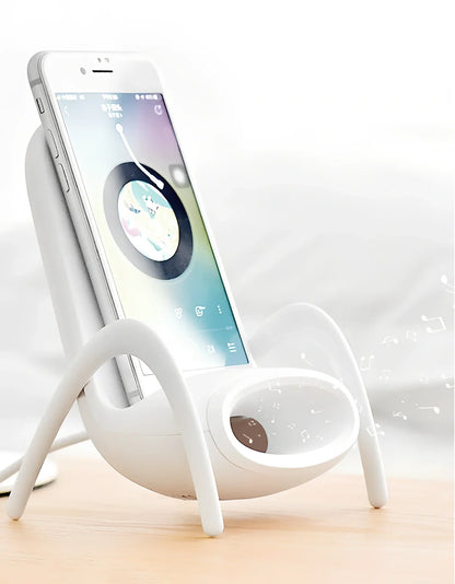 Black amplified wireless charger with bracket, 9.8 x 9.8 x 14.2 cm, for phone charging and audio boost