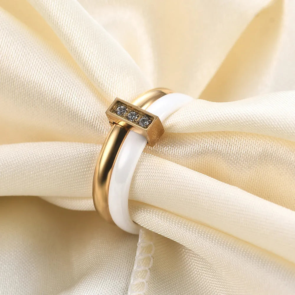 Glossy black ceramic women's ring with a zirconium inlay on a 6mm wide band.