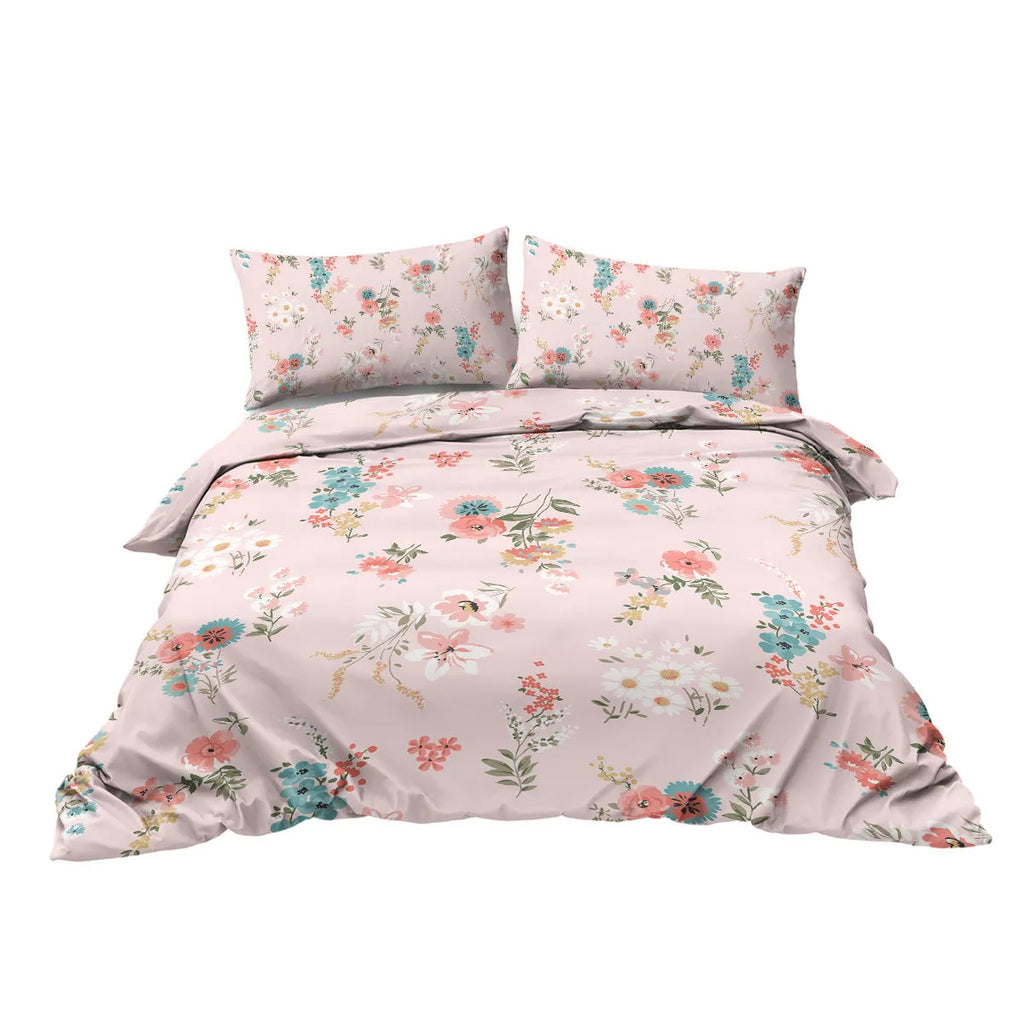 Pink floral microfiber duvet set with two pillow shams on a bed