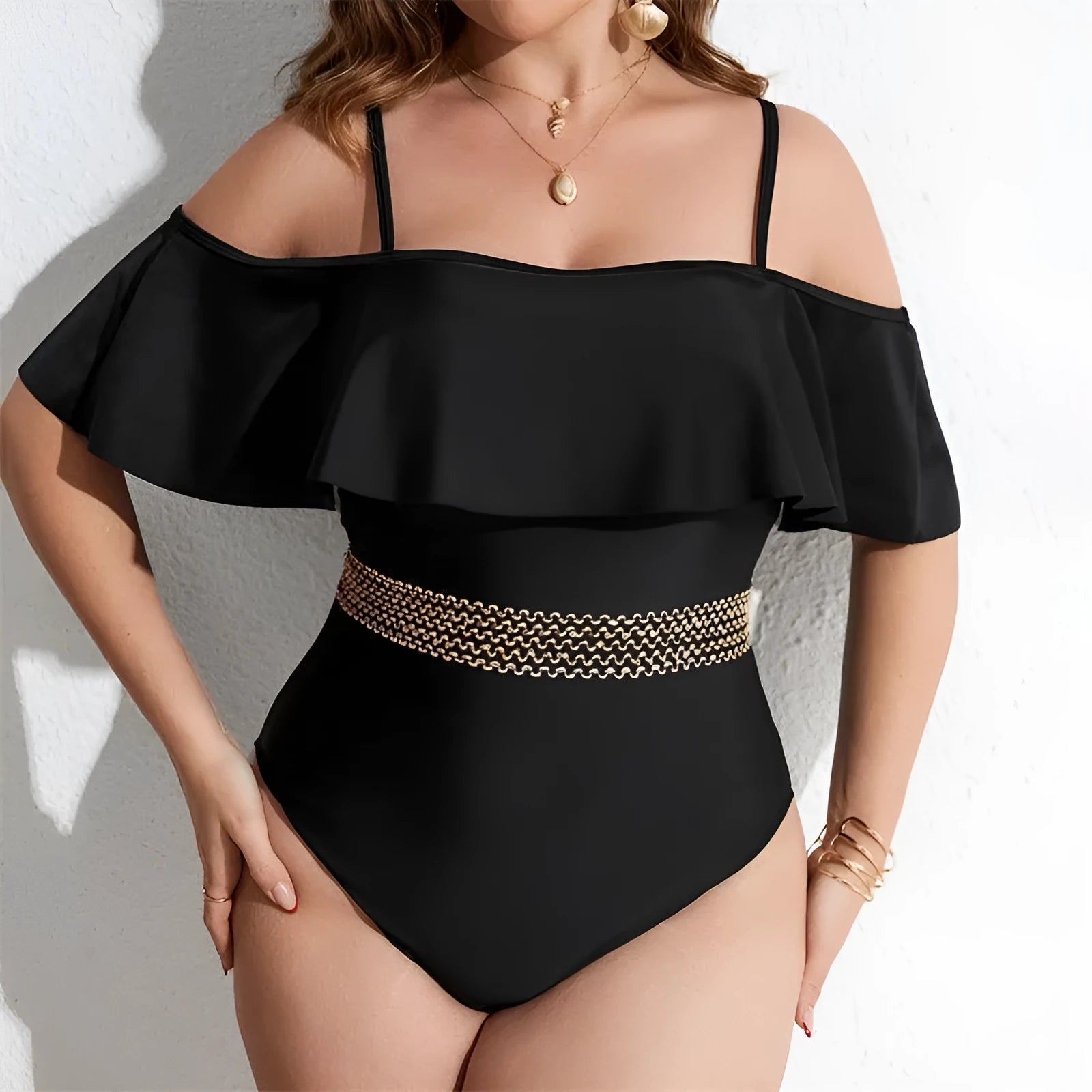 Black women's one-piece swimsuit on hanger, plus size range 0XL to 4XL.