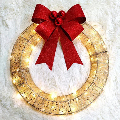 Festive 20-inch luminous LED Christmas wreath with gold and green tinsel garland and large bow