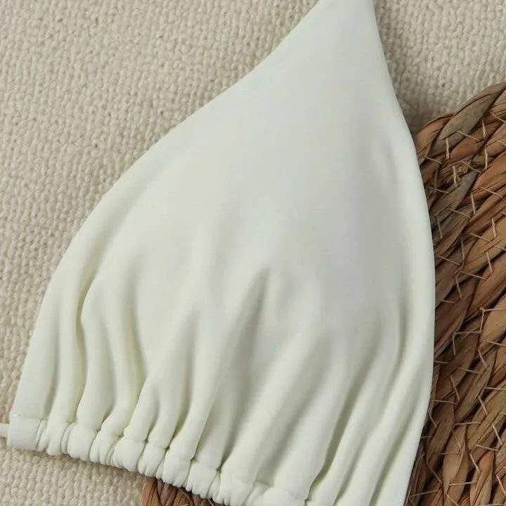 XINGX women's lace-up bikini swimsuit in creamy-white with nylon fabric and brief bottom for beach or hot spring use