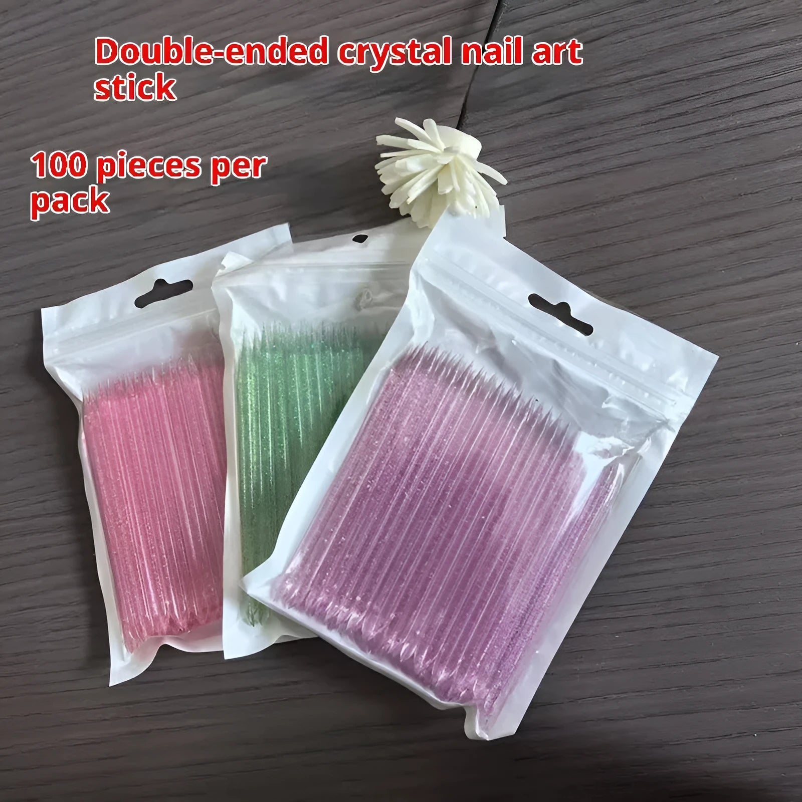 Nail glue sticks 100pcs in assorted colours including pink, blue, green, and purple, 7.5cm and 9.3cm lengths