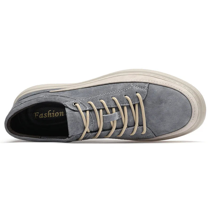 Men's grey pigskin leather low-top casual skate shoes with round toe and flat rubber sole.