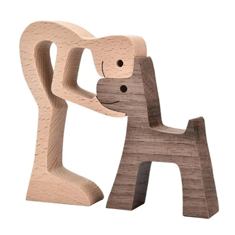 Handcrafted wooden dog sculpture featuring a man and his loyal canine companion