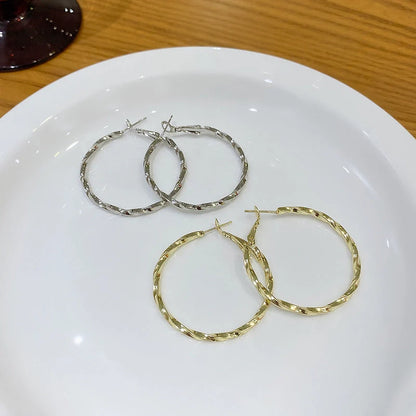 Geometric alloy earrings in gold and silver finishes