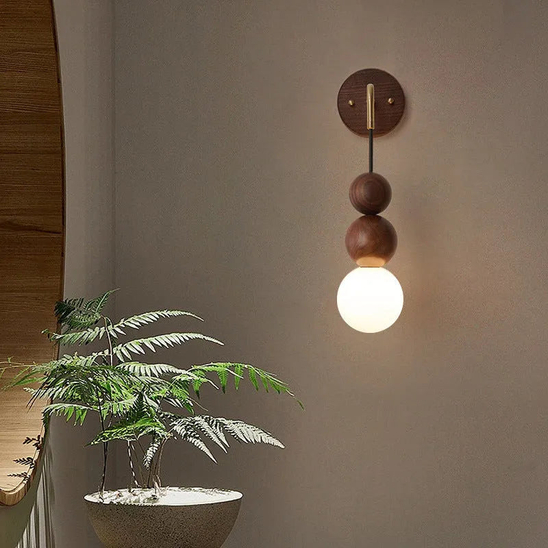 Wood and copper wall lamp with lollipop shade and tri-colour light for bedside or living room.