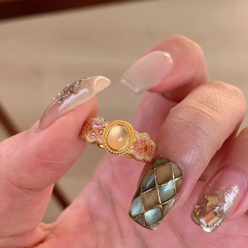 Pink crystal enamel geometric open mouth ring on a gold-plated copper band.
