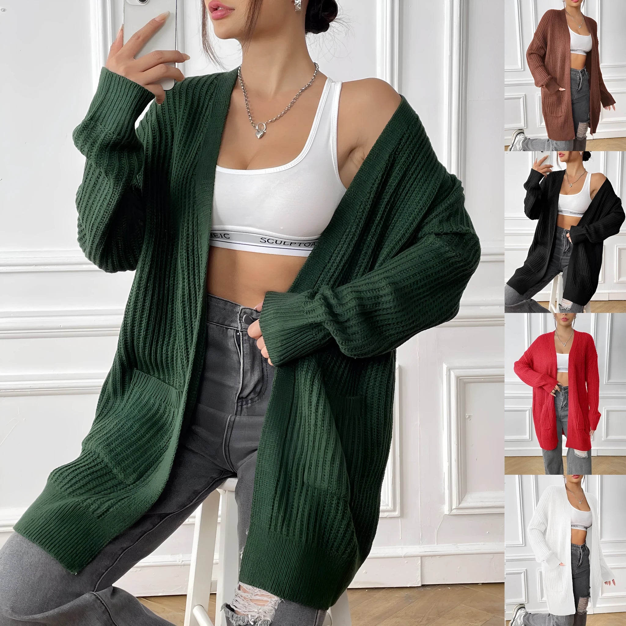 Women's dark green loose-fit acrylic cardigan sweater with double pockets and long sleeves.