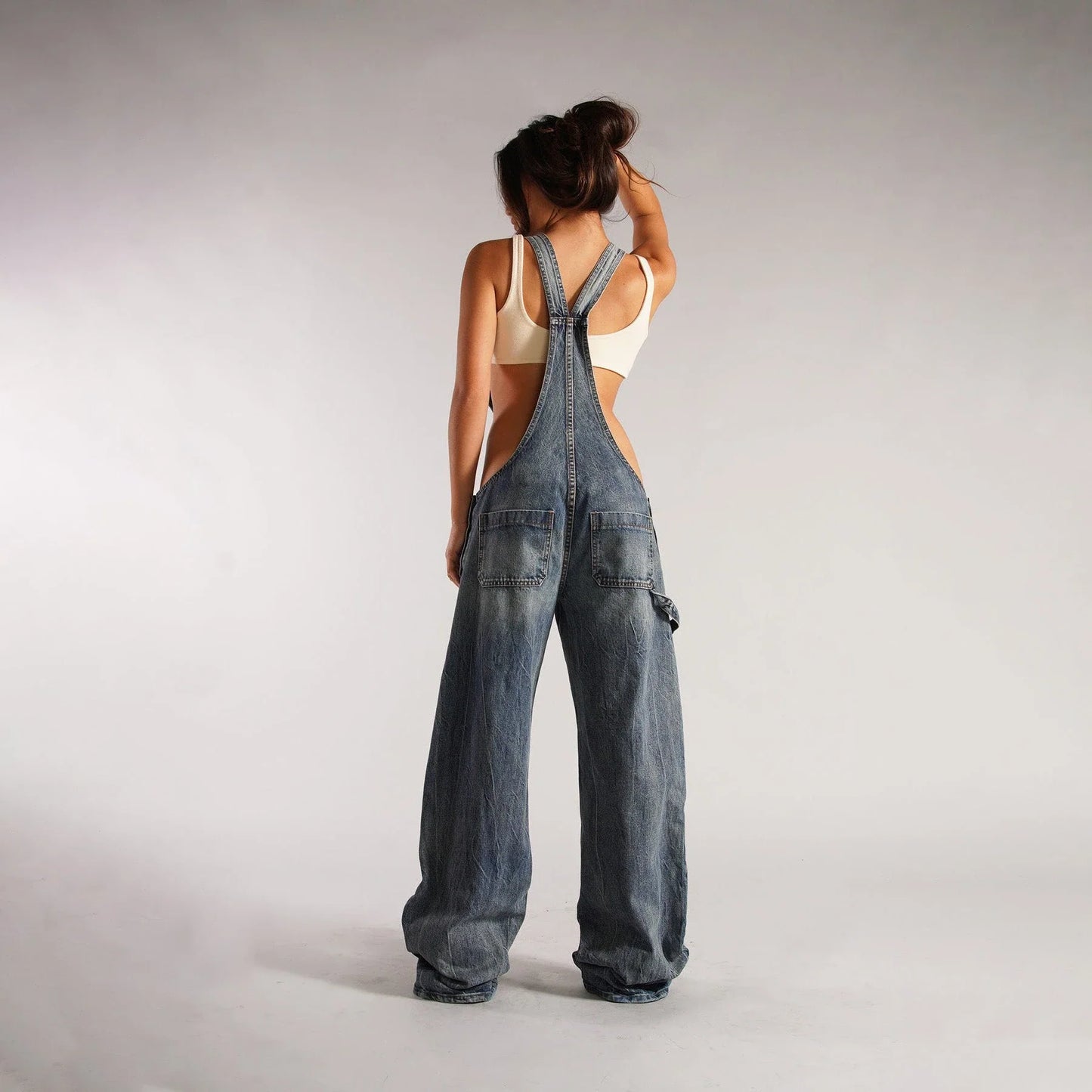 Trendy denim overalls with pockets, featuring a unique Y2K-inspired design, micro-elastic fit, and convenient layout for a stylish and comfortable streetwear look.