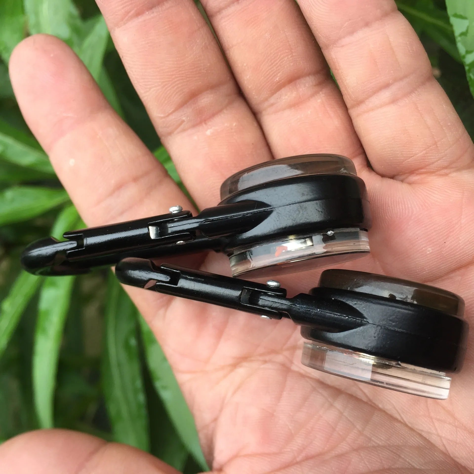 Black zinc alloy double-sided button carabiner with visible thermometer and compass gauge.