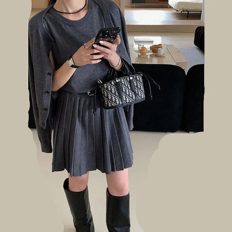 Women's grey art retro knitted vest skirt and long-sleeved cardigan two-piece set with belt.