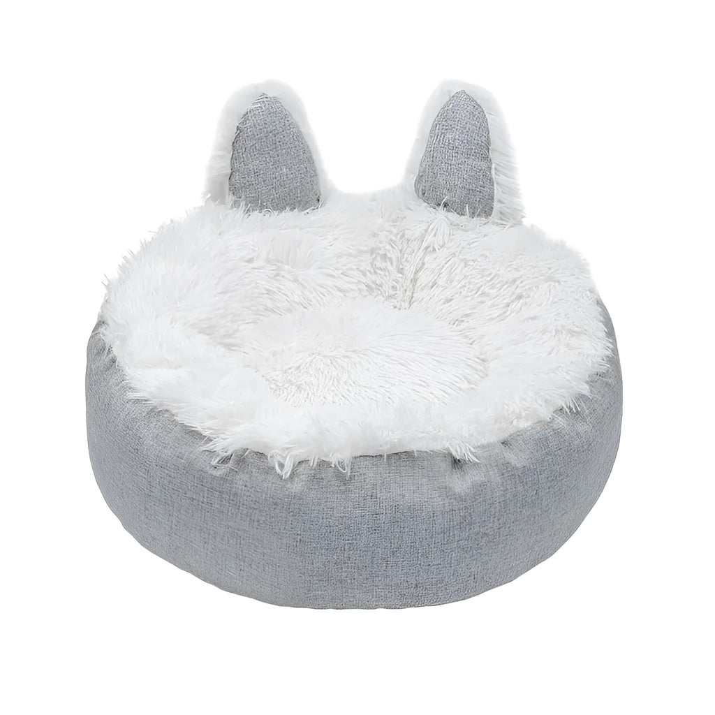 Blue faux fur plush enclosed cat bed house on a wooden floor