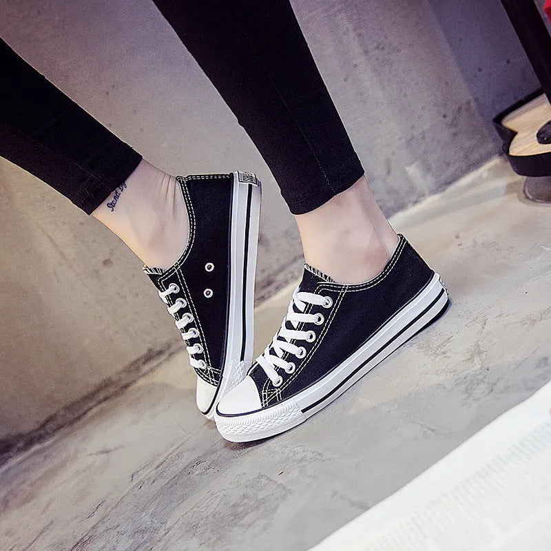 Women's solid colour casual canvas shoes shown in black, white black, white red, and all black options.