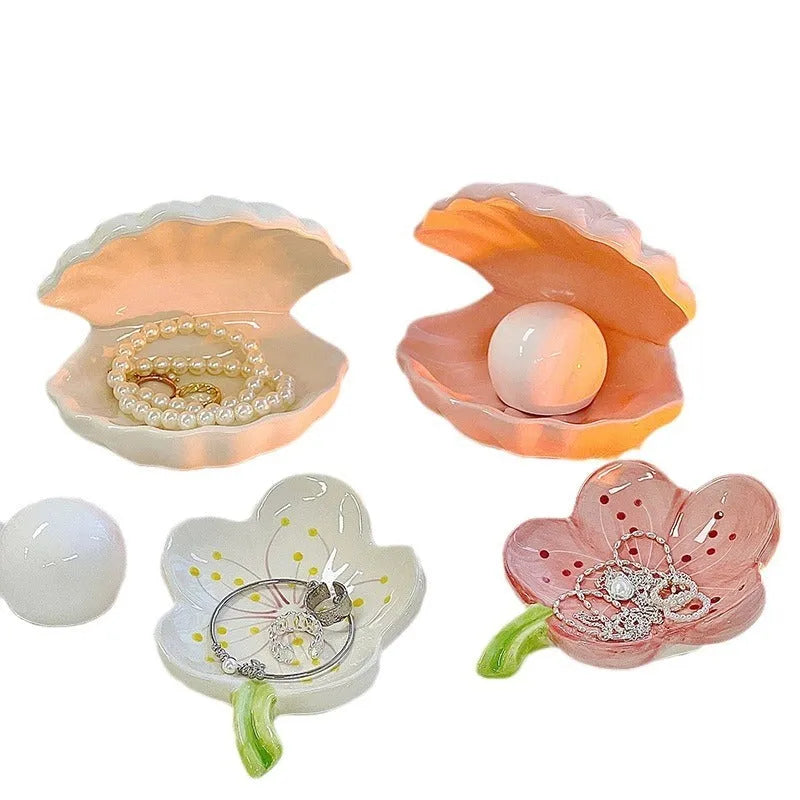 Yellow porcelain ornamental tray with optional night light, shown with white and pink shell options.