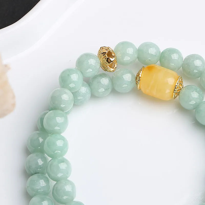 Double-layer women's bracelet with emerald jade round beads and beeswax barrel beads in geometric design