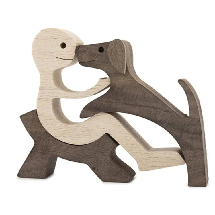 Handcrafted wooden dog sculpture featuring a man and his loyal canine companion