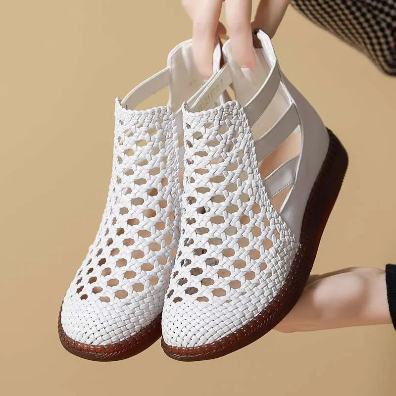 Gold and white women's flat sandals with hollow-out PU upper and soft TPR sole.