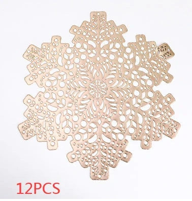 Stylish snowflake-patterned placemats in gold and silver, designed for heat resistance and spill protection on dining tables