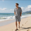 Linen blend short sleeve shirt and shorts beach suit set laid flat, showing army green colour option.