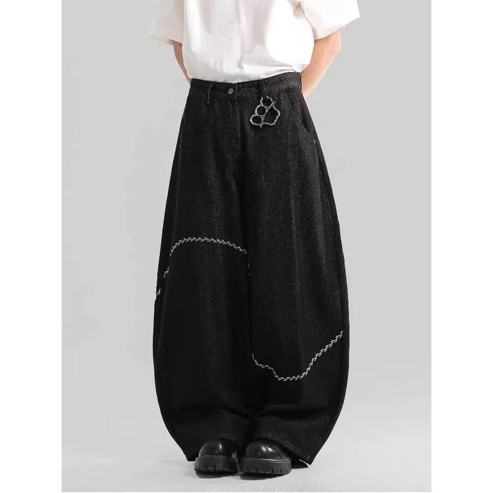 Black straight-leg polyester denim trousers with a zip fly and micro-elastic waistband.