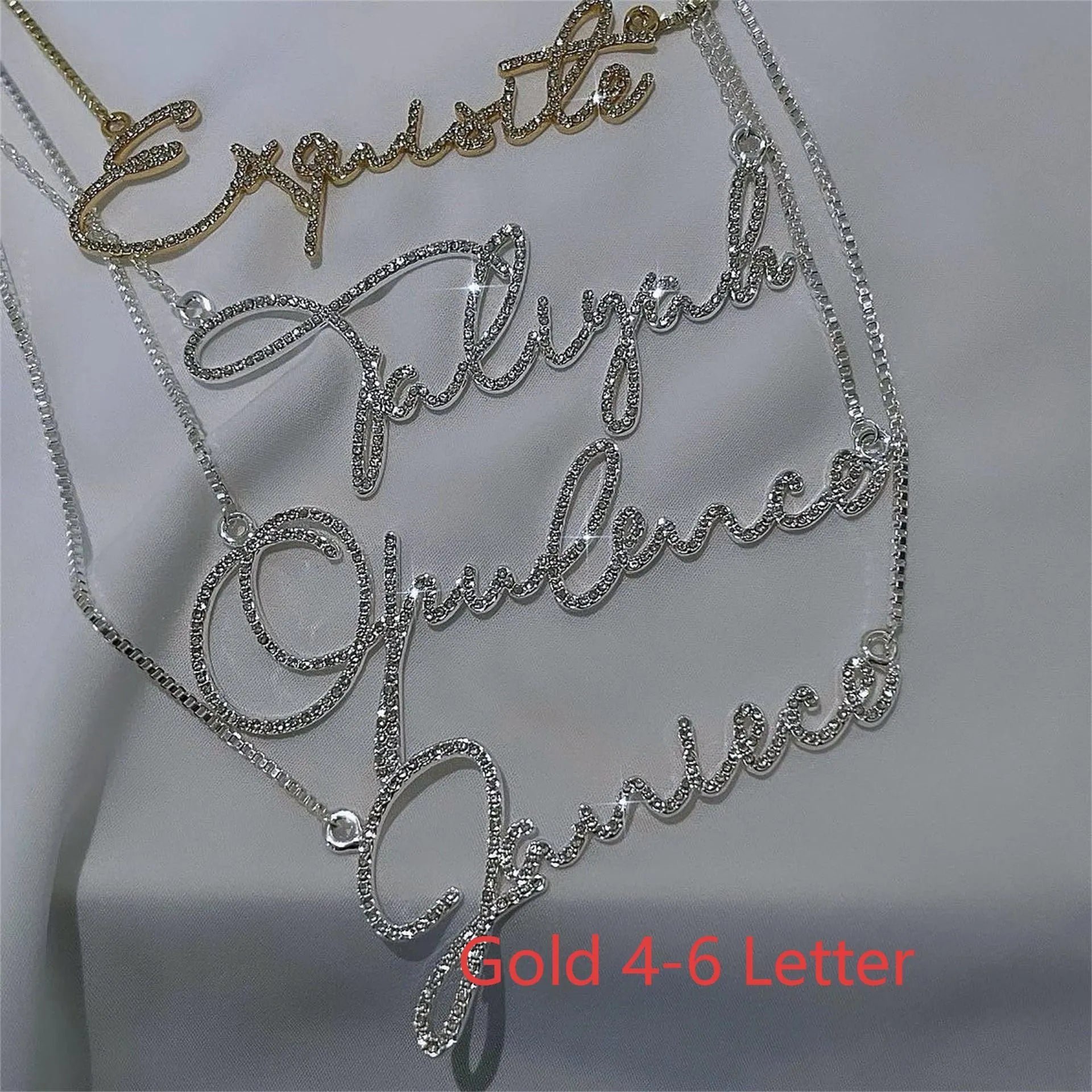Stainless steel name necklace with diamond-studded letters on a chain, shown in silver, gold, and rose gold finishes.