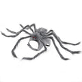 Grey and black spider Halloween costume for a small dog on a carpet.
