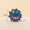 Colourful natural latex squeaky dog ball with cute face and textured surface for teeth cleaning.