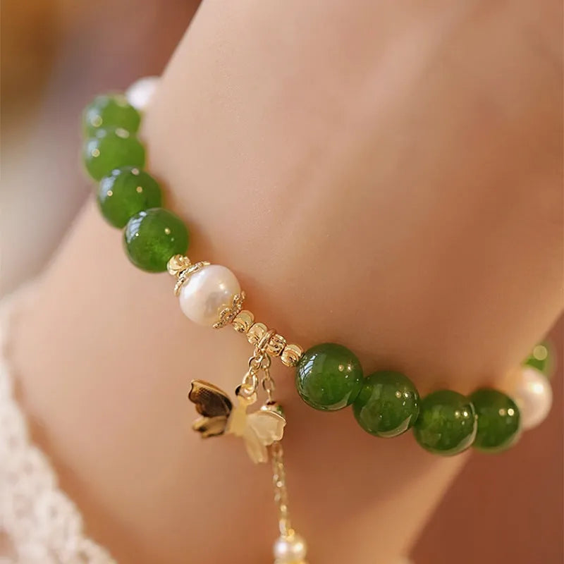 Natural green chalcedony gemstone bracelet with round beads in a minority design style for women.