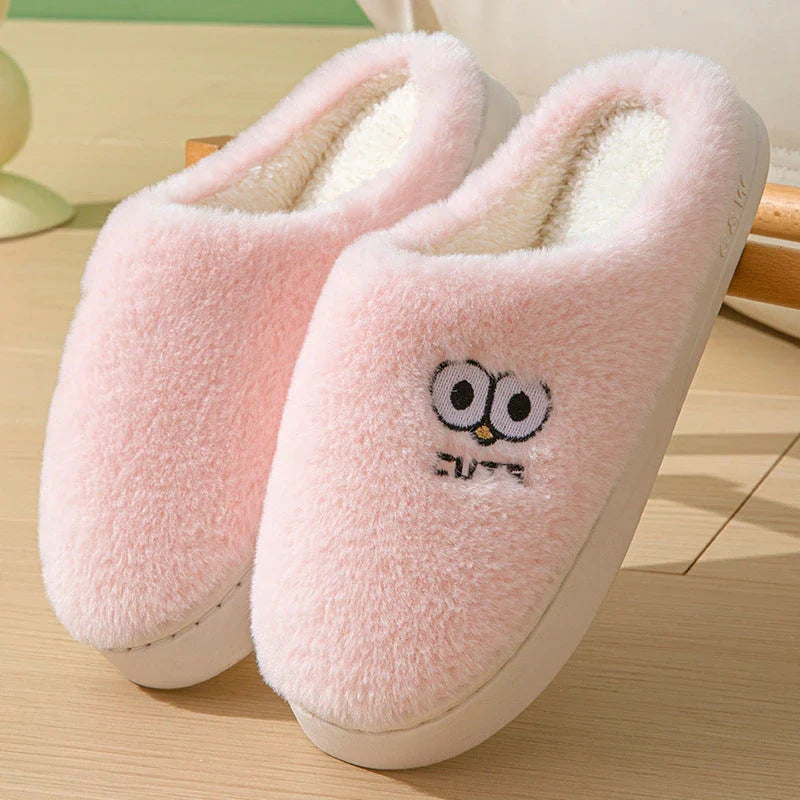 Cozy cartoon slippers with big eyes in various colors, featuring plush material and non-slip rubber soles for comfortable indoor wear