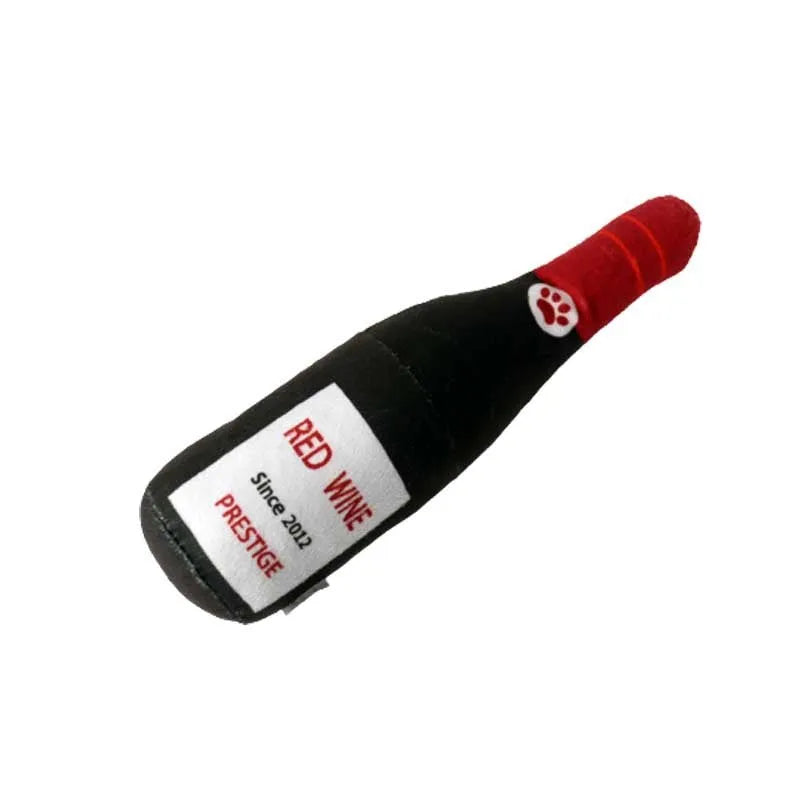 Soft green plush dog toy shaped like a wine bottle with a squeaker inside.