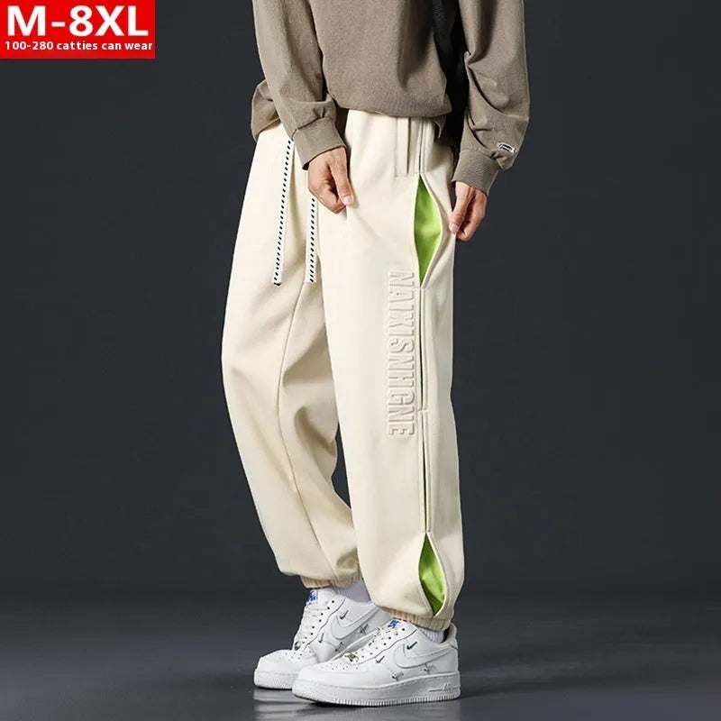 Men's grey green loose fit jogger pants with elasticated ankle bands and waist.