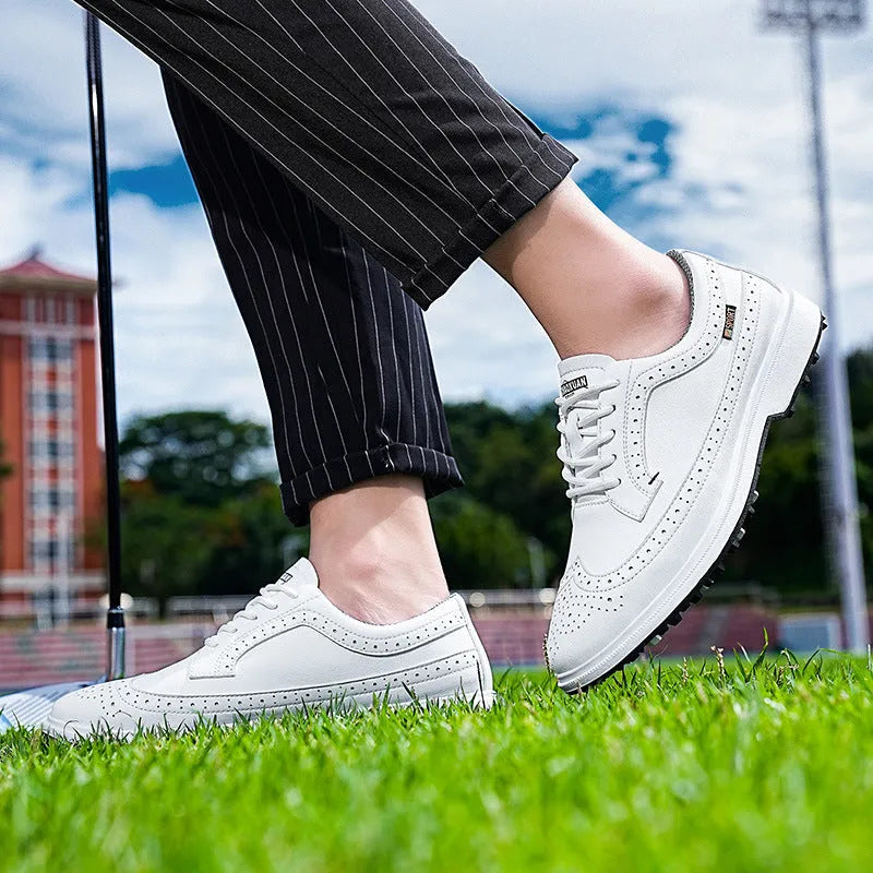 Men's Lake Blue genuine leather golf shoe with non-slip rubber sole on a golf course.