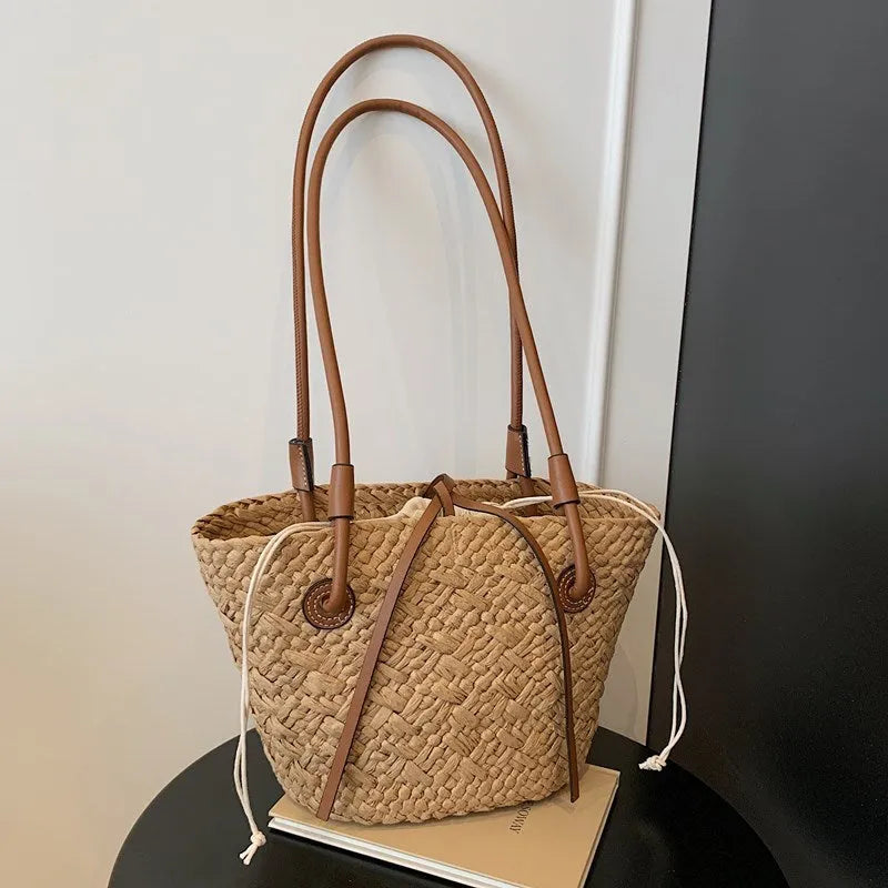 Beige and khaki woven bag with large capacity and dual shoulder or hand-carrying options in retro style