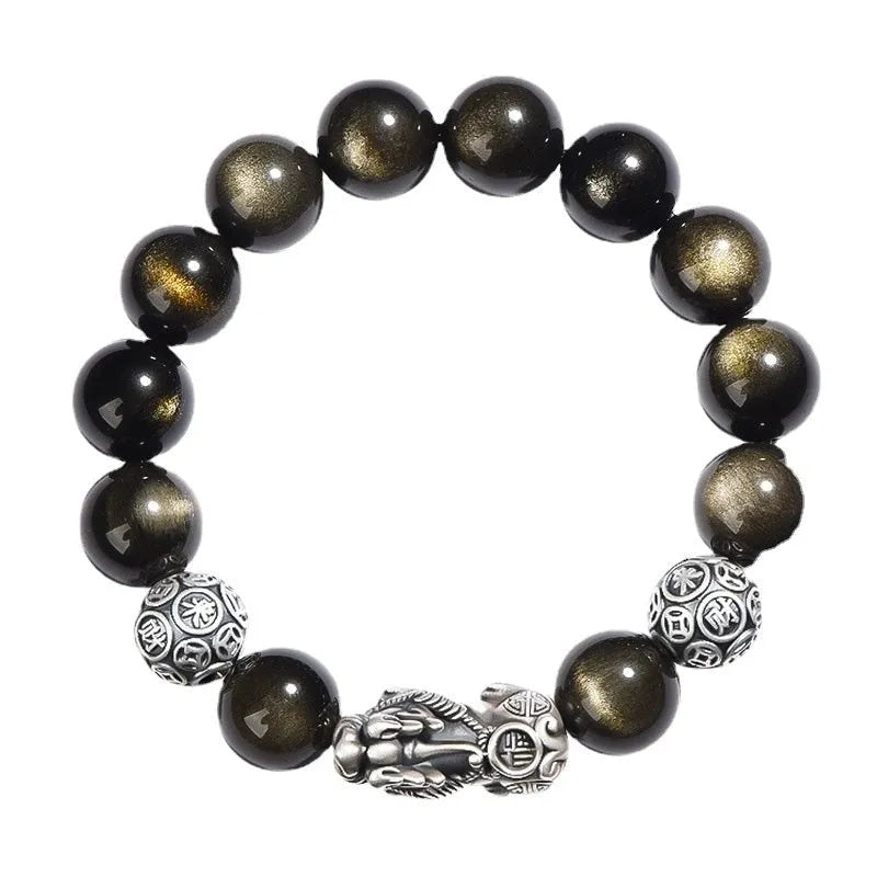 Men's geometric bracelet made of black obsidian and polished 999 sterling silver, showing its width and structured design.