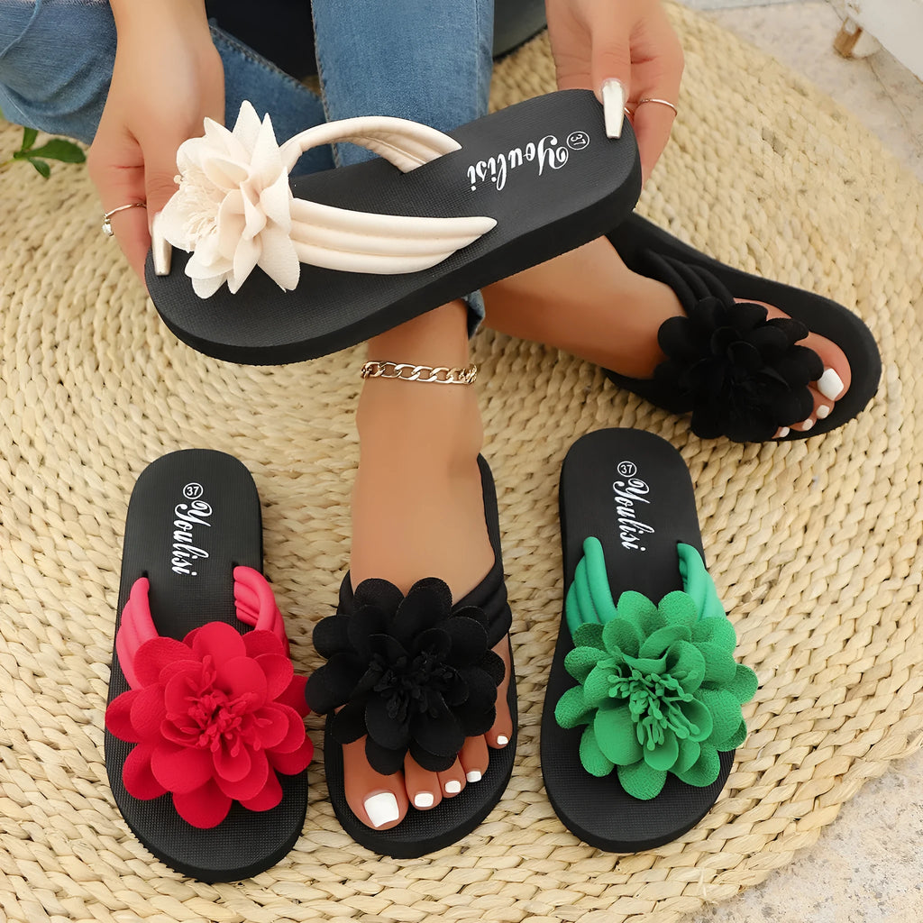 Casual beige flip-flops with a floral pattern on the straps and a light-coloured EVA sole.