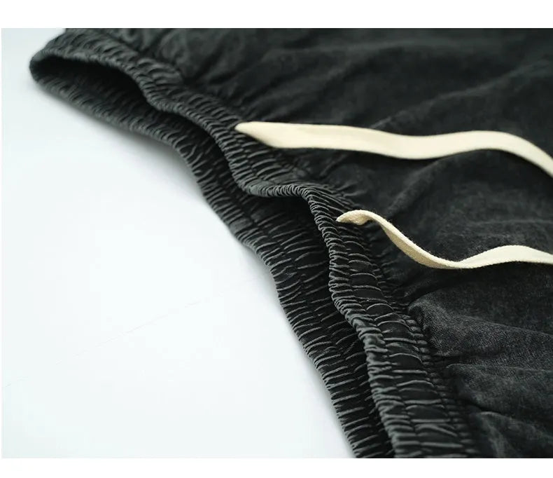 Men's vintage washed loose drawstring shorts in 100% cotton, black colour, front view