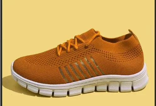 Women's high-cut lace-up sneaker in a choice of colours, showing breathable upper and flat rubber sole.