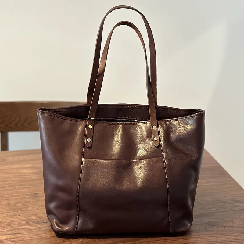 Horizontal square first-layer cowhide leather single-shoulder bag in brown with sewing thread detail and multiple pockets
