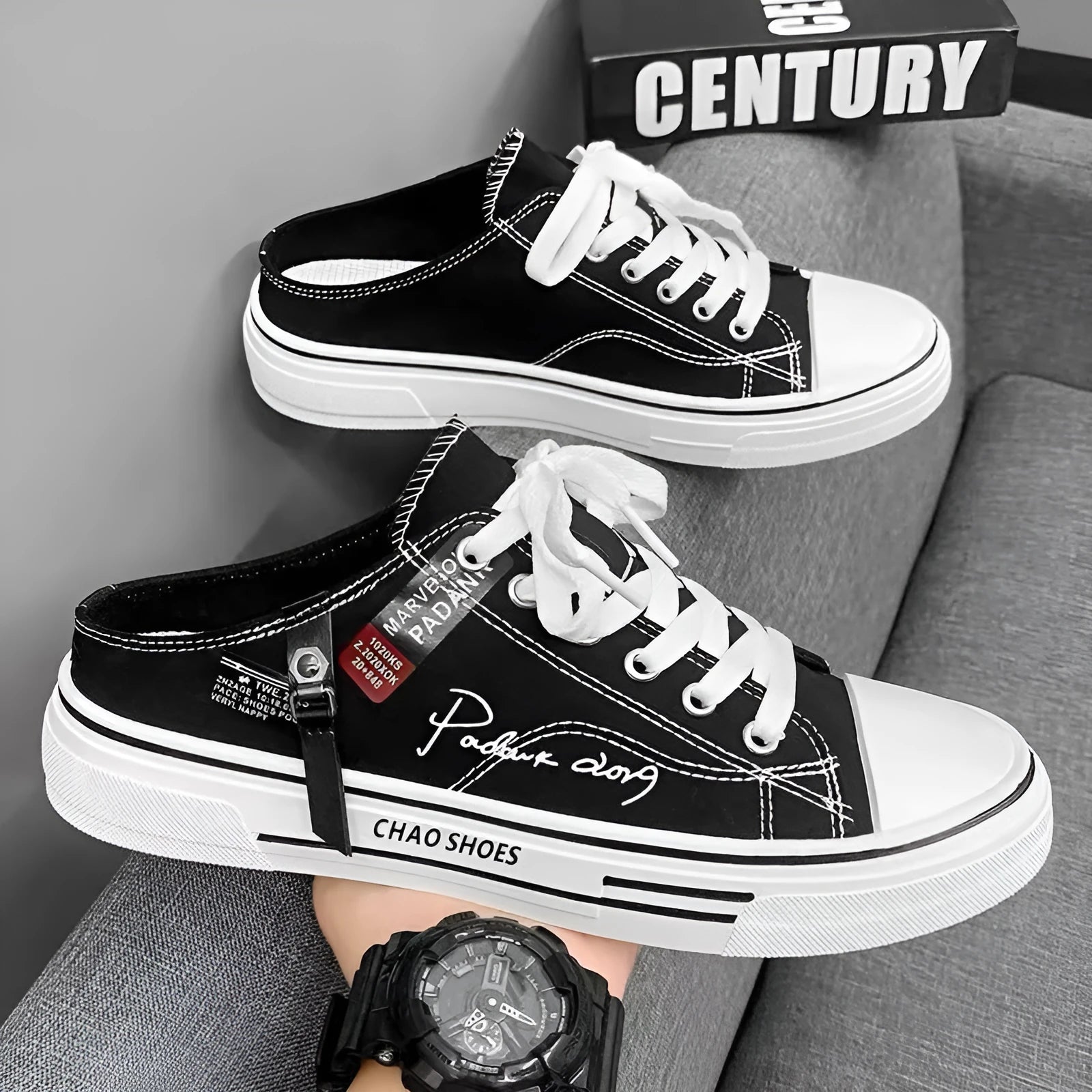 Men's black canvas slip-on casual shoes with round toe and injection moulded sole.