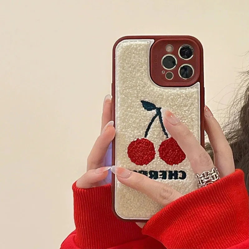 Red plush full lens phone case with cherry design for iPhone showing camera module coverage