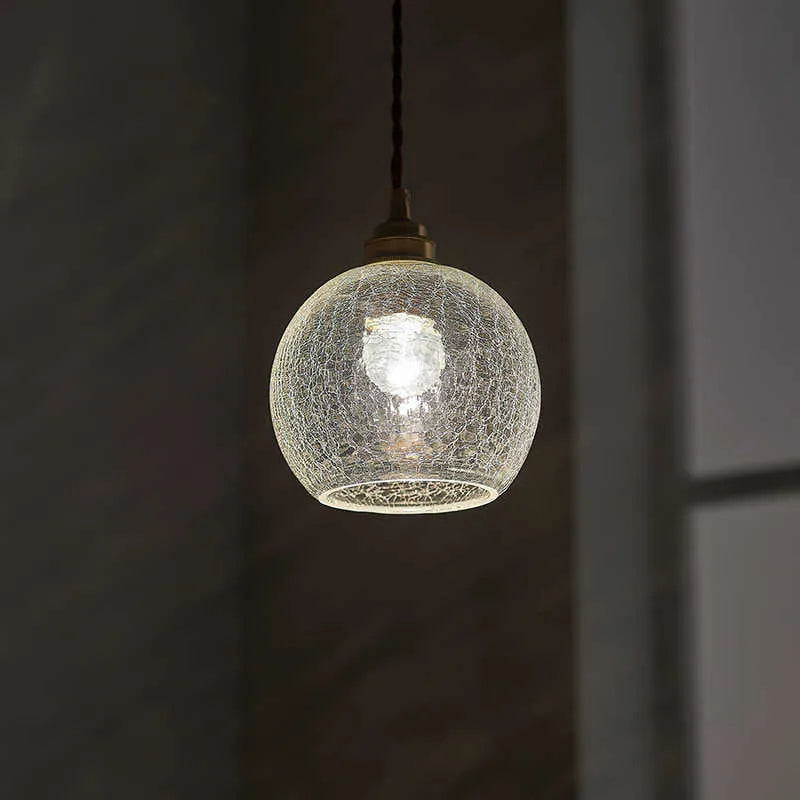 Retro style brass and glass ball chandelier with compact dimensions on a white background.