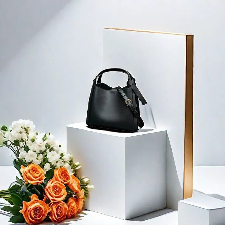 Women's soft cowhide crossbody bucket bag showing interior zipper compartments and sewing thread detailing