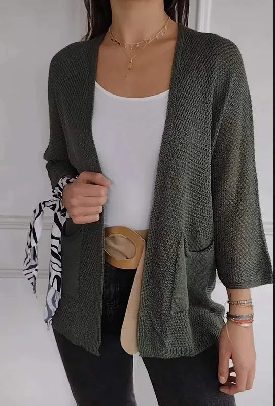 Women's waffle texture cardigan coat in army green with nine-quarter length sleeves and pockets.