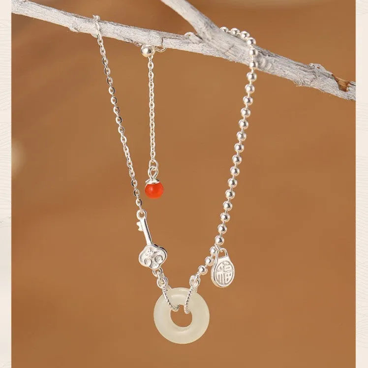 Women's Hetian jade bracelet in 925 silver with peace buckle charm, geometric Chinese style design