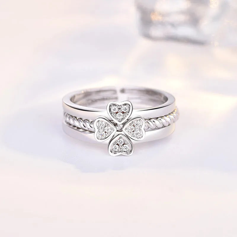 Four-leaf clover adjustable ring set for women with spinning top and zircon stones in white gold finish