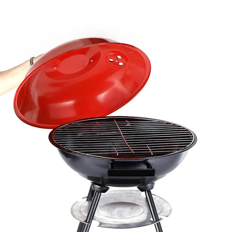 Portable 14-inch iron barbecue grill with a minimalist design on a patio.