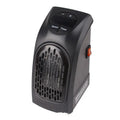 Compact black ceramic fan heater with rotatable EU plug on a desk