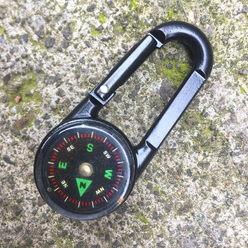 Black zinc alloy double-sided button carabiner with visible thermometer and compass gauge.